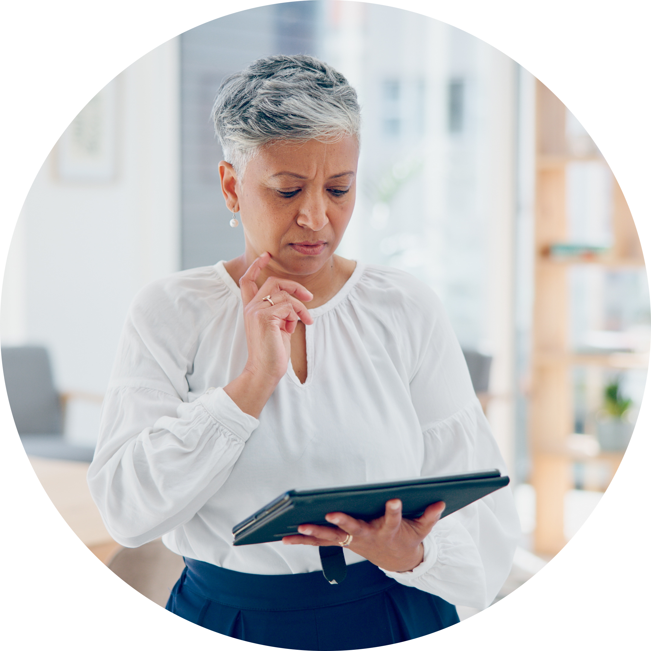 AdultLearners-52-older woman looking at ipad with grey hair-circle.png